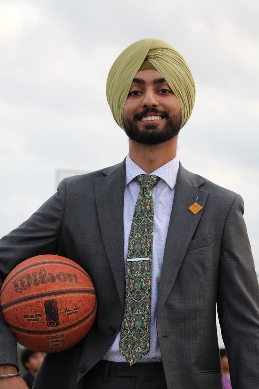Prabhnoor Singh holding a basketball